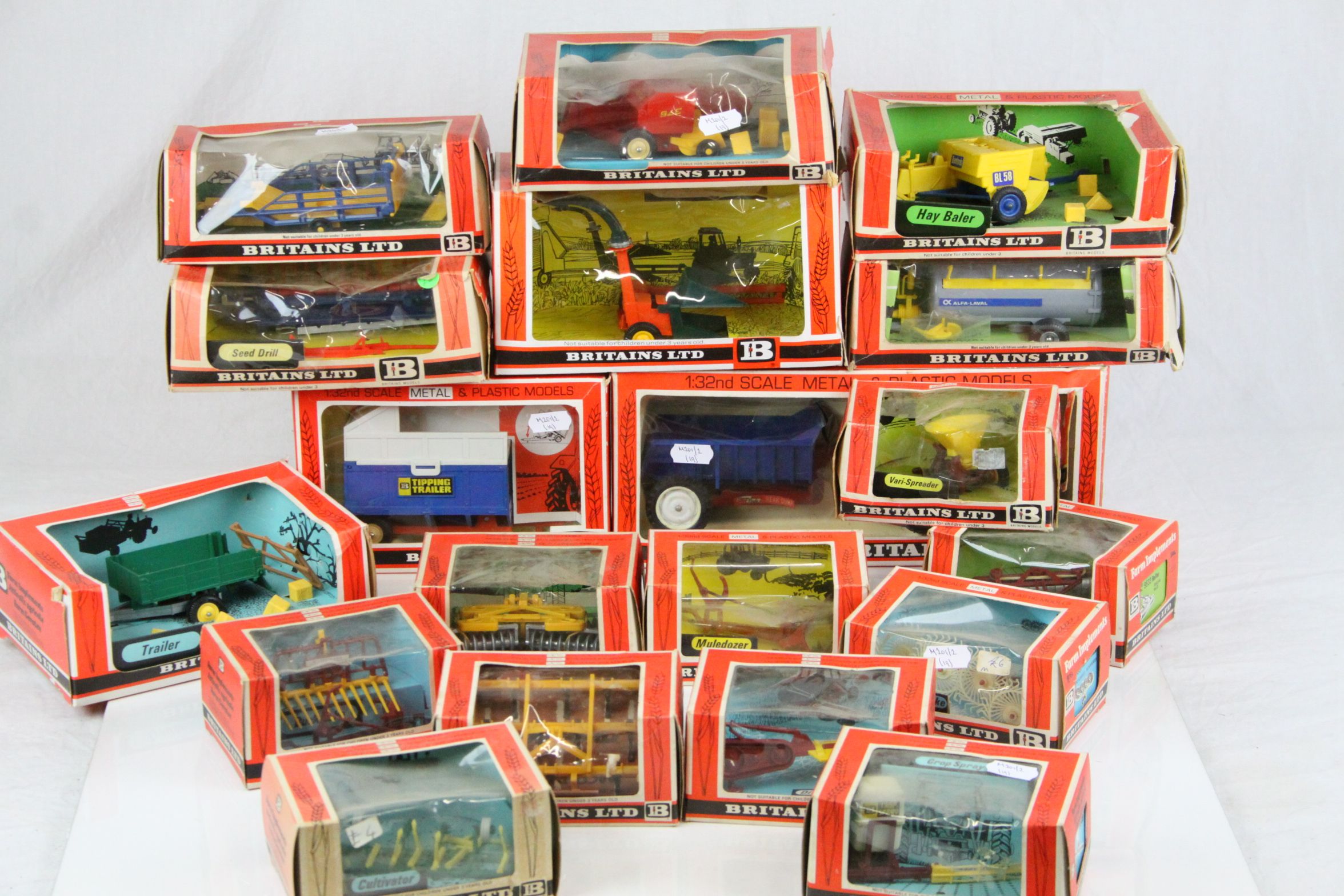 19 boxed 1:32 scale diecast Britains farm implements,to include nos. 9535, 9553, 9537, 9557, 9560,