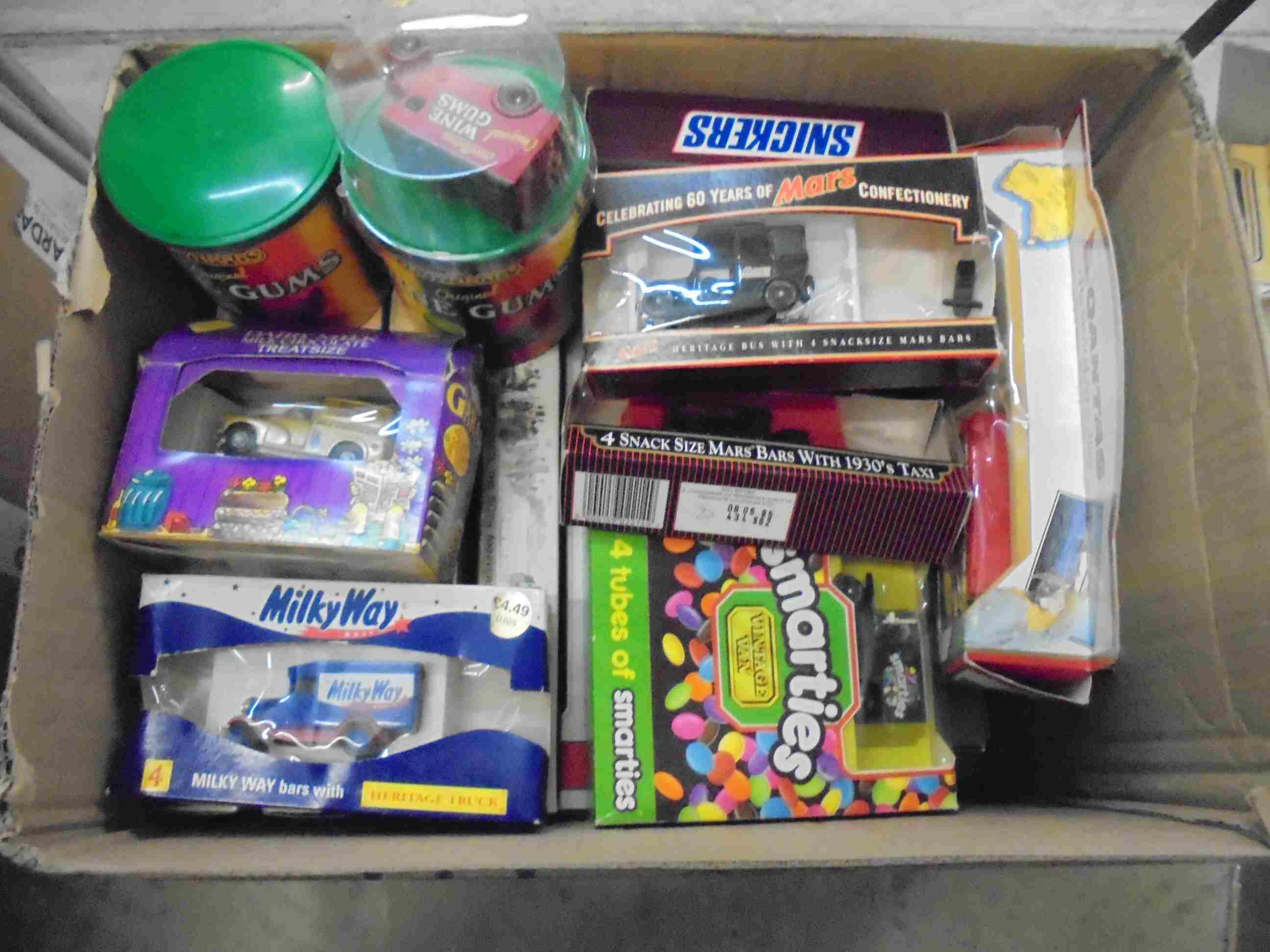 Approx.30 boxed Lledo diecast models to include Qantas, Wine Gums, Smarties, Snickers, Mars,