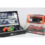 Three boxed/cased slot cars to include Fly 1:32 A27 Marcos LM 600,Ninco 50162 F310 BN 5 and Slot.