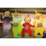 Four wooden hand painted Teletubbies featuring Tinky Winky, Dipsy, Laa-Laa & Po