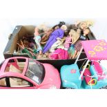 Collection of dolls to include Barbie, Barbie car and golf buggy etc