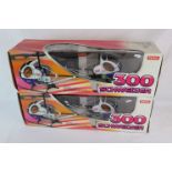 Two boxed Syma Radio Control Schweizer 300 Helicopters, both complete