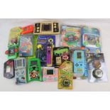 Quantity of circa 1990s electronic hand held games and collectables to include Tiger The Little