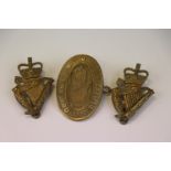 A Collection Of 3 Brass Badges To Include Two Ulster Defence Regiment Cap Badges With Rear Sliders