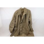 A Small Collection Of Military Clothing To Include A Demobilised Soldiers Raincoat Dated 1956 And