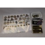 A Collection Of Military Collectables To Include Belt Buckles, Inert Brass Shell Cases And A