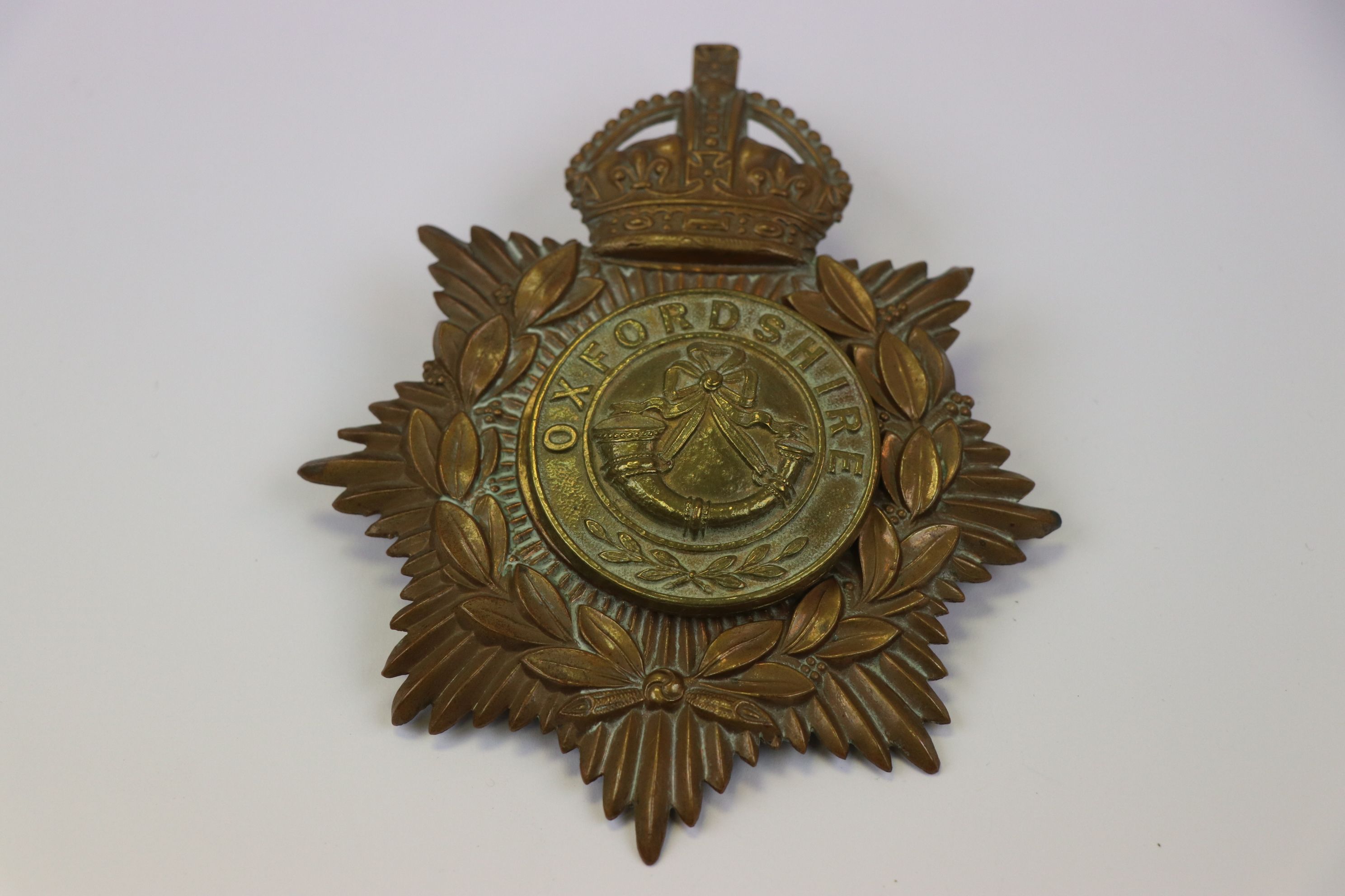 A Vintage Brass Kings Crown Helmet Plate With Oxfordshire Regiment Centre Badge.