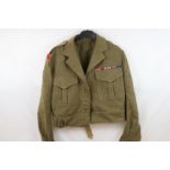 A British Army Battle Dress Uniform Complete With Cloth Badges To The Royal Engineers And Medal