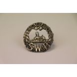 A Sterling Silver South Wales Border Regiment Cap Badge, Marked Sterling To The Rear With Twin