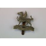 A 2nd Battalion Of The Monmouthshire Regiment White Metal Cap Badge With Slider To The Rear.