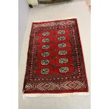 Small Red Ground Rug with Geometric Pattern within a Border, 123cms x 79cms