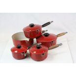 Set of Five Le Creuset Red Saucepans with Wooden Handles (four with lids)