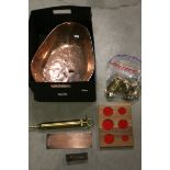 An NFO Lubricant Co brass injector pump, a set of bell weights with copper weighing pan etc