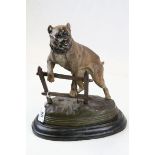 Bronze figure of a dog chained to a fence signed Charles Valton