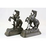 Pair of Marley horses with handlers mounted on a base stamped 'Made in Belgium'