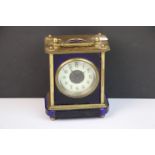 Antique blue glass and brass carriage clock with white enamel face.