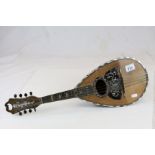 Antique mandolin with white metal and mother of pearl inlay