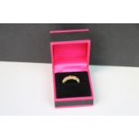 18CT yellow gold ring set with trio's of diamonds