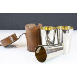 Early 20th century Leather cased set of three graduated gilt lined silver plated Hunting Beakers,