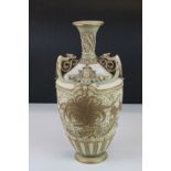 Early 20th century Royal Worcester blush ivory vase with bird of paradise and griffin decoration,