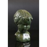 Green painted bust of a boy