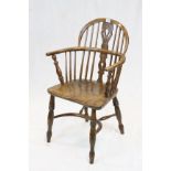 Antique elm hoop back elbow chair with crinoline stretcher