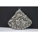 Yunnanese white metal fan shaped pendant, the pierced form with repousse bird, butterfly and