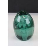 19th century Green glass dump paperweight with internal flower decoration, 13cms high