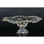 Contemporary glass fruit bowl with scalloped edge decoration, raised on an oak leaf and acorn