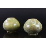 Pair of early 20th century Ruskin style ovoid squat vases, indistinctly marked to underside