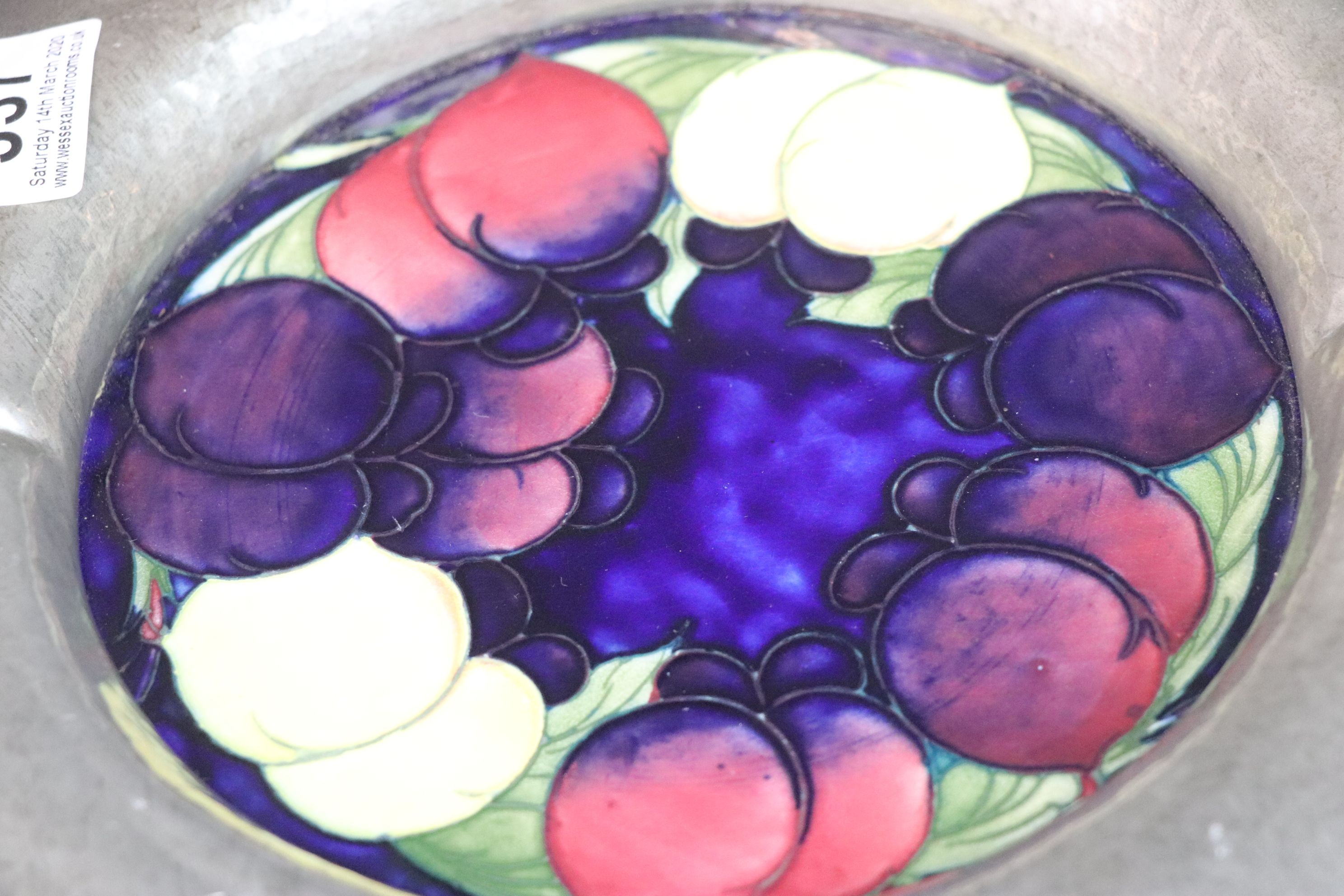 A Moorcroft wisteria pattern plaque set into an english made pewter surround. - Image 3 of 3