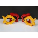 Four Bakelite Napkin Rings being Two Yellow in the form of Fish and Two Red in the form of