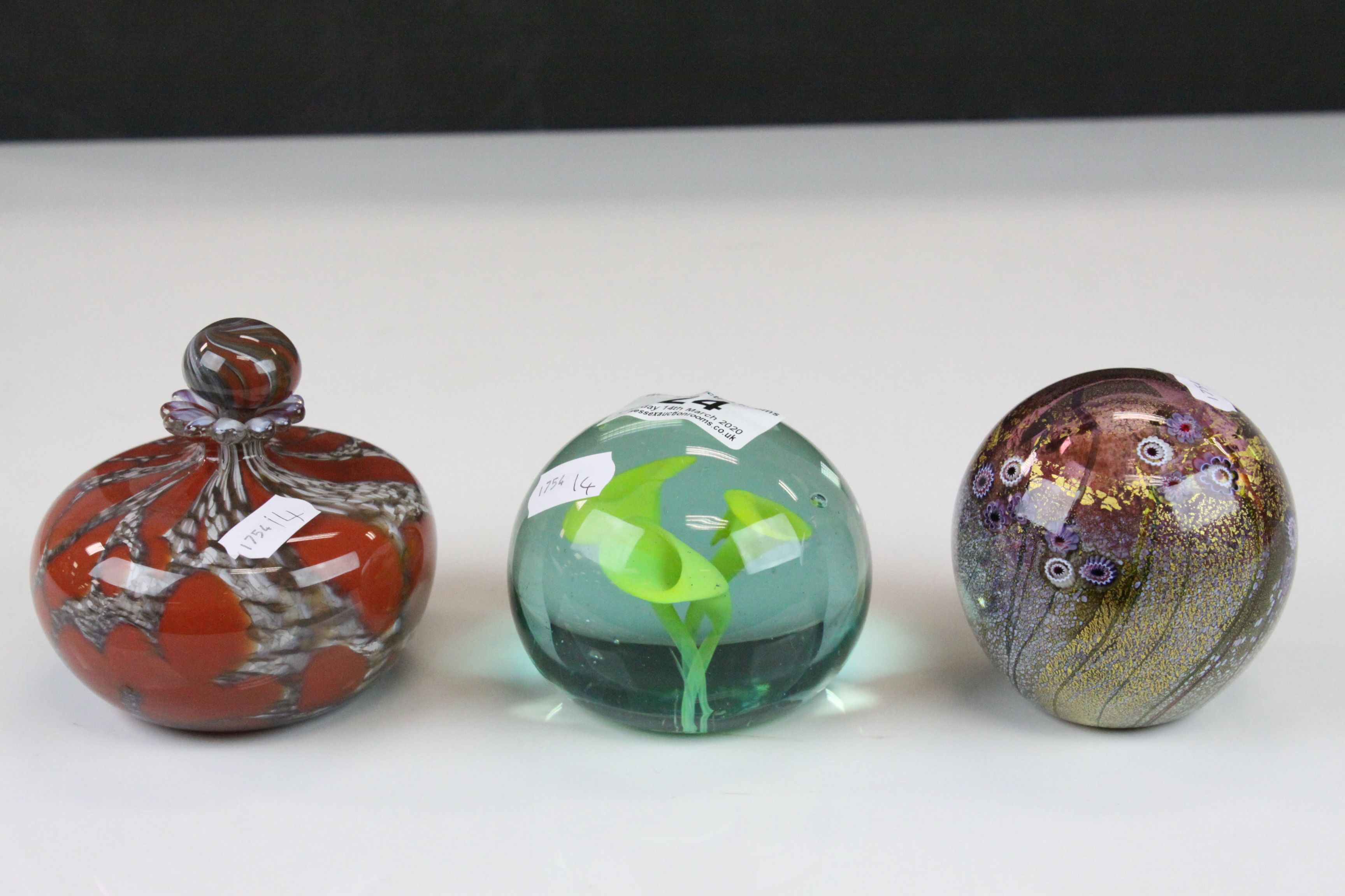 Jonathan Harris ' Wilderness ' glass paperweight, another paperweight with internal flower and a