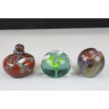 Jonathan Harris ' Wilderness ' glass paperweight, another paperweight with internal flower and a