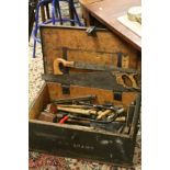 Antique wooden toolbox containing similar tools, to include spirit levels, squares, saws, mallets,