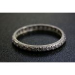 A vintage white metal stone set full eternity ring.