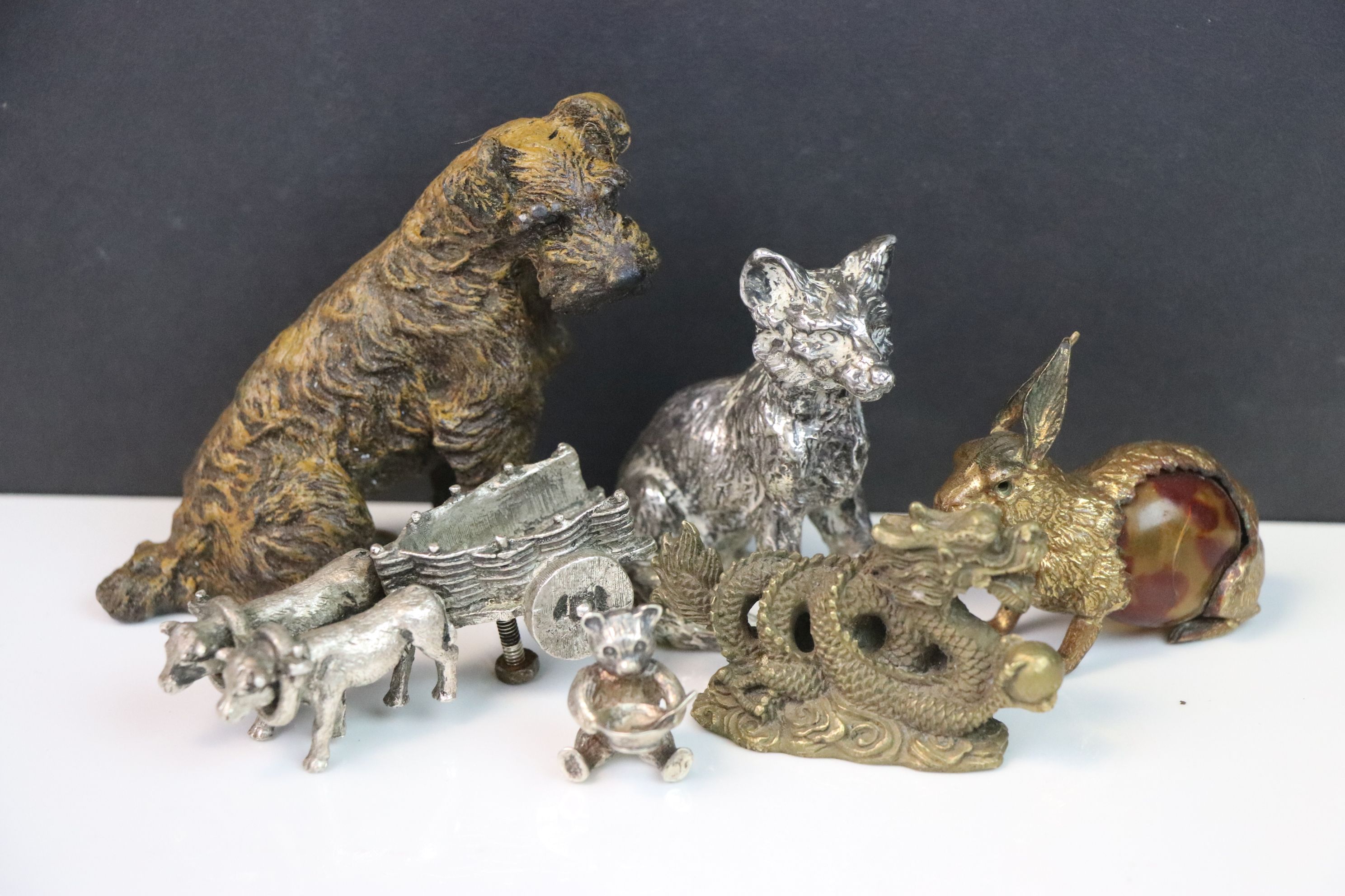 Collection of metal animal figures to include a small solid silver bear