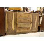 Mid 20th century Oak Sideboard with Four Central Drawers flanked either side by Cupboards, 137cms