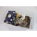 A box of mixed costume jewellery to include necklaces, brooches and watches.