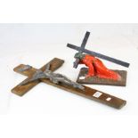 White metal and wooden crucifix, together with a carved wood figure of Jesus crawling with the