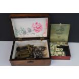 A collection of old keys and padlocks contained within a wooden box together with a box of bone