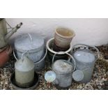 Three galvanized watering cans, a similar bird feeder & lidded bucket, group of flowerpots etc