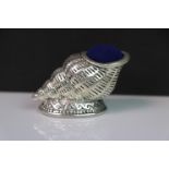 Silver conch shell pincushion