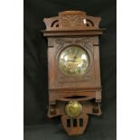 Oak cased Wall clock with engraved Art Nouveau decoration, brass Dial with Sun engraving plus Sun