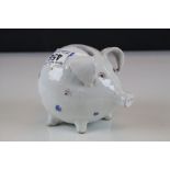 Early 20th century pottery piggy bank money box with floral stylised decoration
