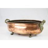 Copper Oval Planter with Twin Brass Lion Mask Handles and Four Brass Lion Paw Feet, 41cms long