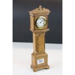 A German made miniature grandfather clock. Approx 33cm in height.