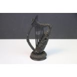 A Victorian 19th century Irish bog oak carved harp with shamrock decoration, Approx 13cms in