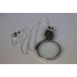 Silver magnifying glass pendant necklace with cat finial
