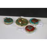 A collection of four buddhist pendants to include three prayer box examples.